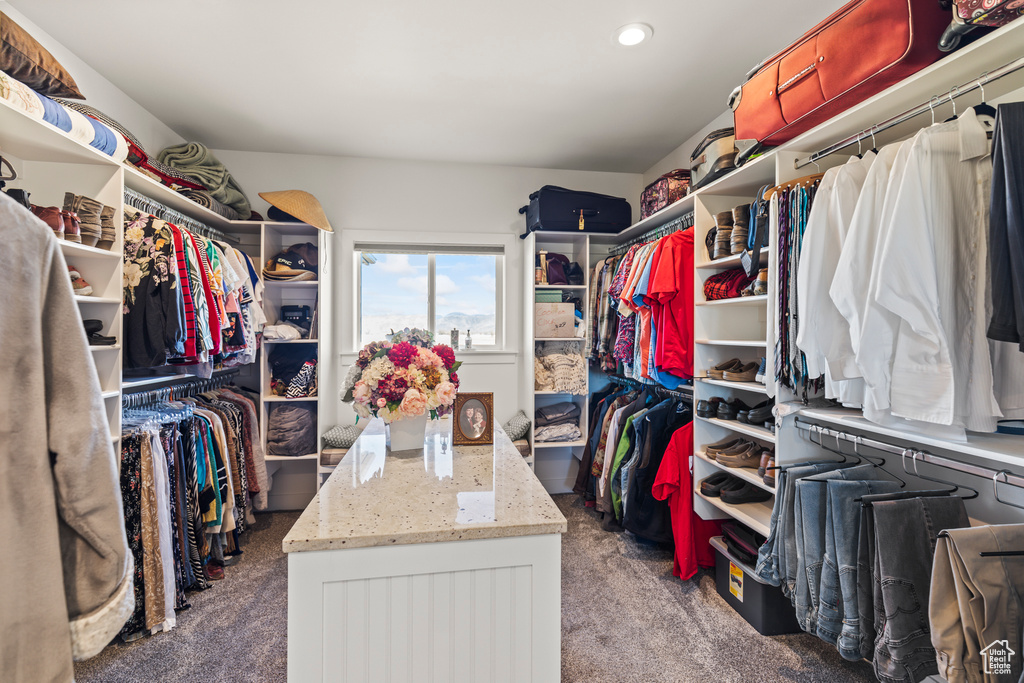 Spacious closet featuring carpet flooring