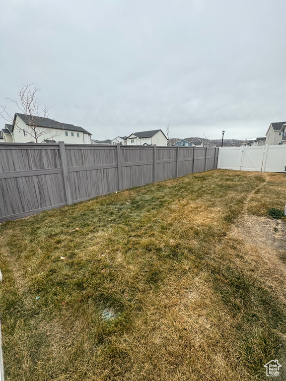 View of yard with a fenced backyard