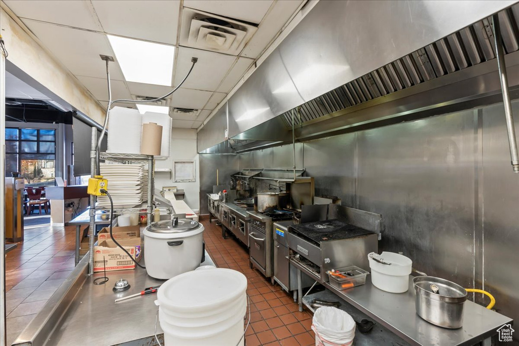 Kitchen with visible vents, dark countertops, and a paneled ceiling