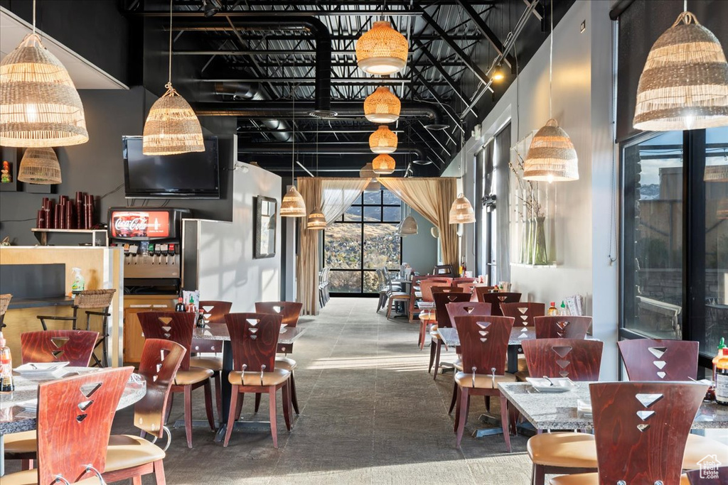 Dining space featuring a towering ceiling