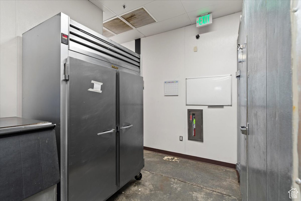 Interior space featuring concrete floors and baseboards