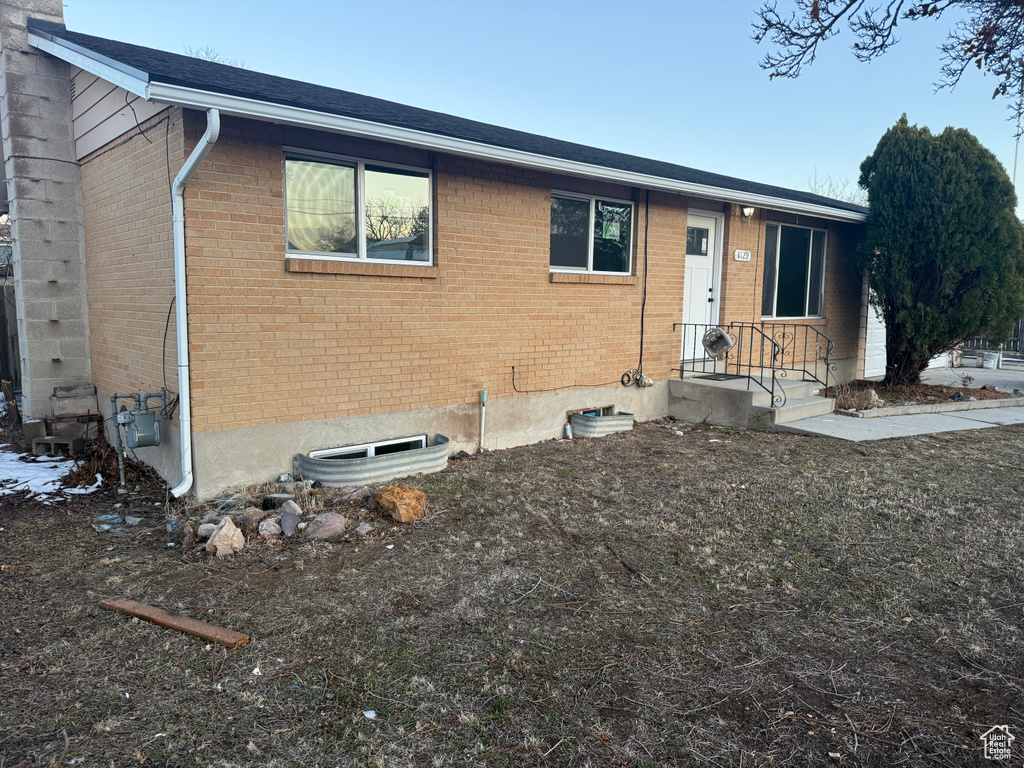 Single story home with brick siding