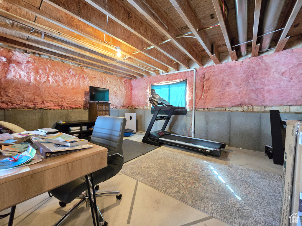 Home office featuring concrete flooring