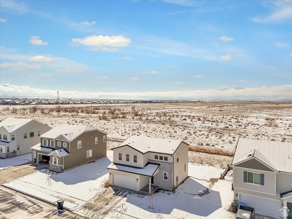 Snowy aerial view with a residential view