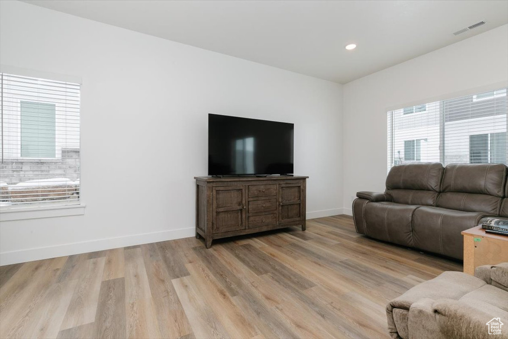 Living room with light wood-type flooring