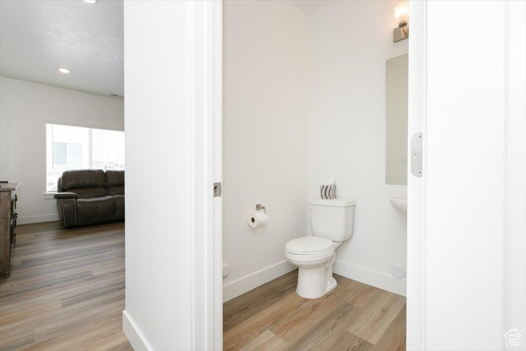 Bathroom featuring toilet and hardwood / wood-style floors