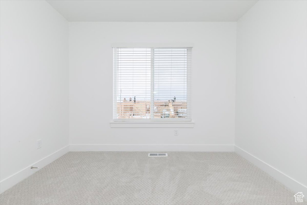 Empty room with carpet floors