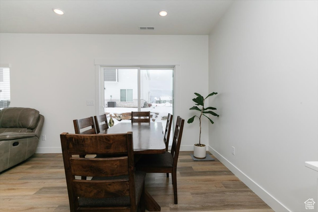 Dining area with light hardwood / wood-style floors