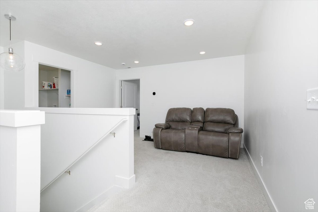 Living room featuring light carpet