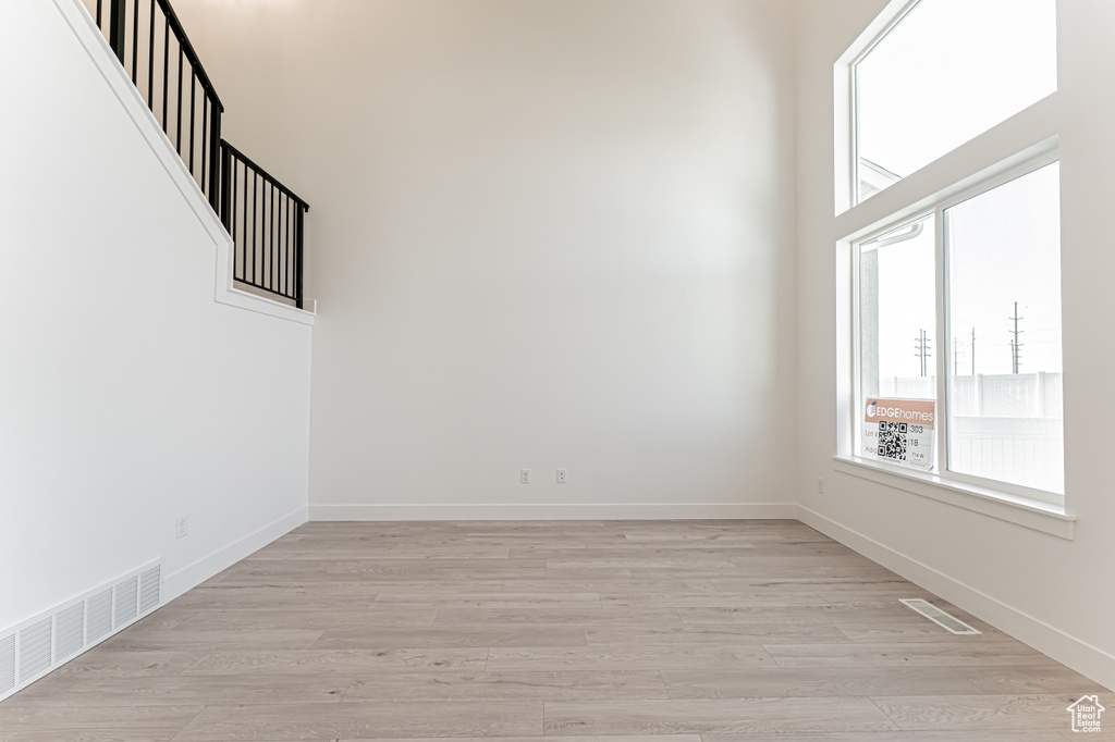 Empty room featuring light wood-style flooring and baseboards