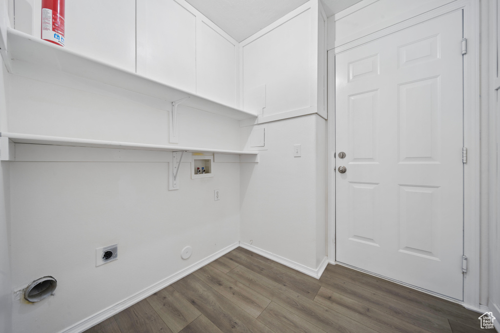 Laundry room featuring hookup for an electric dryer, laundry area, baseboards, dark wood-style floors, and hookup for a washing machine