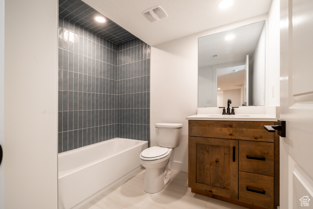 Bathroom featuring vanity, recessed lighting, and washtub / shower combination
