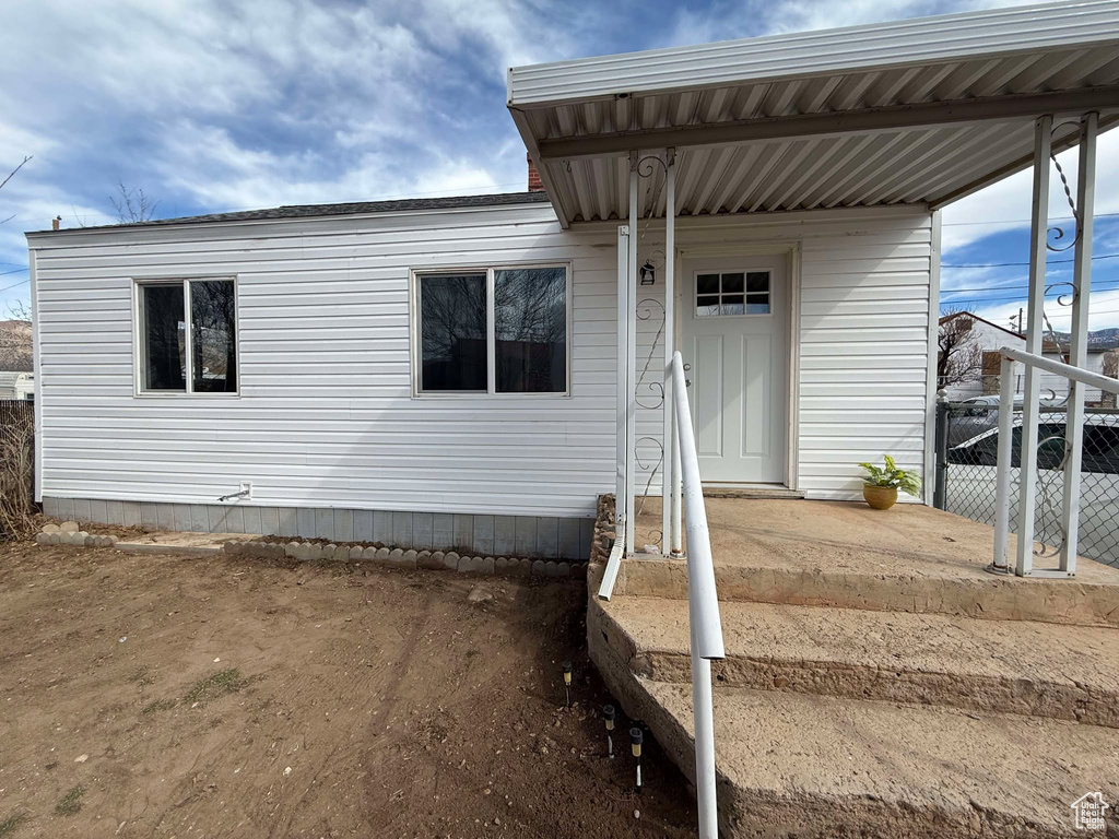 Property entrance featuring fence