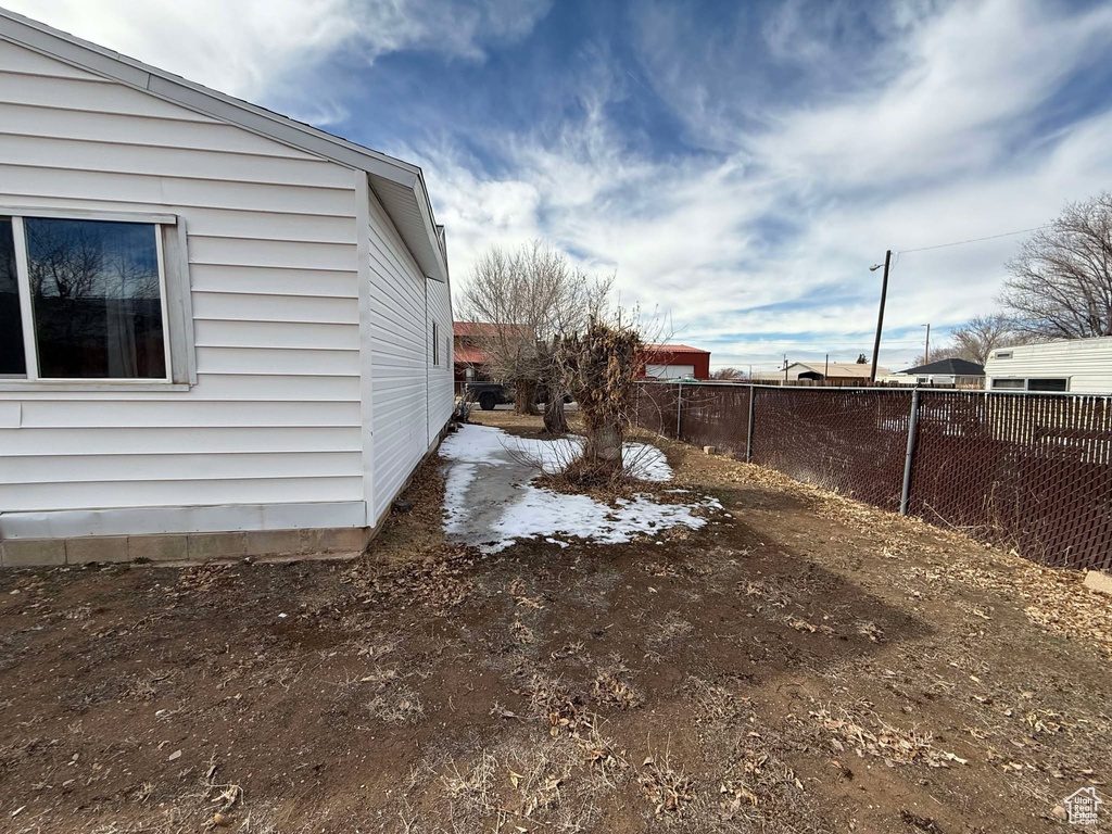 View of yard with fence