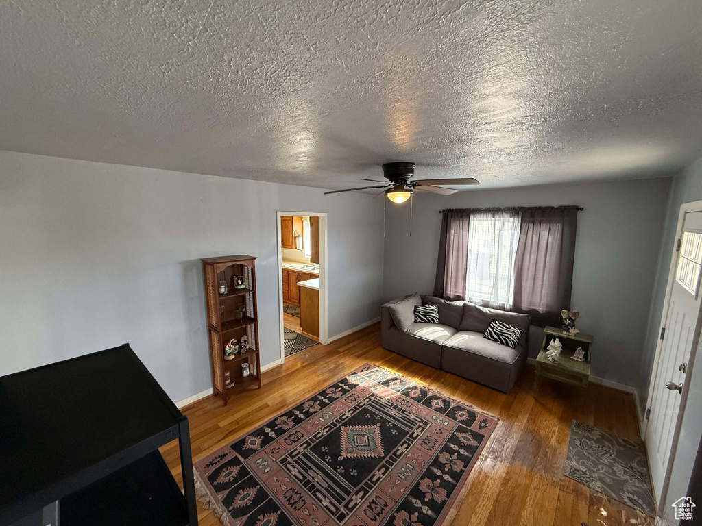 Living area featuring wood finished floors and baseboards