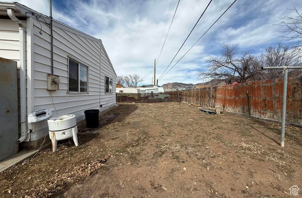 View of yard featuring fence