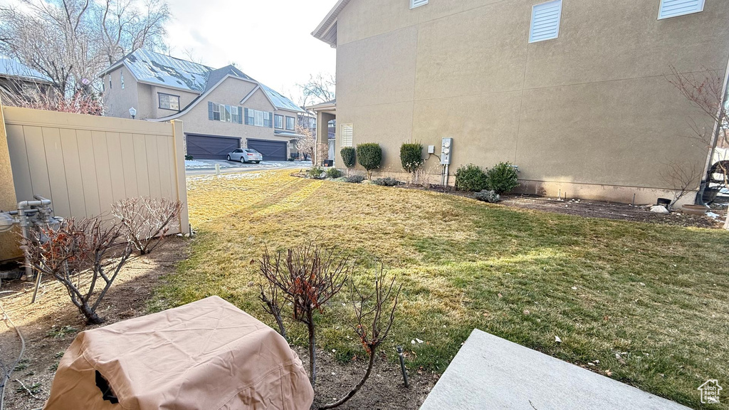 View of yard featuring fence
