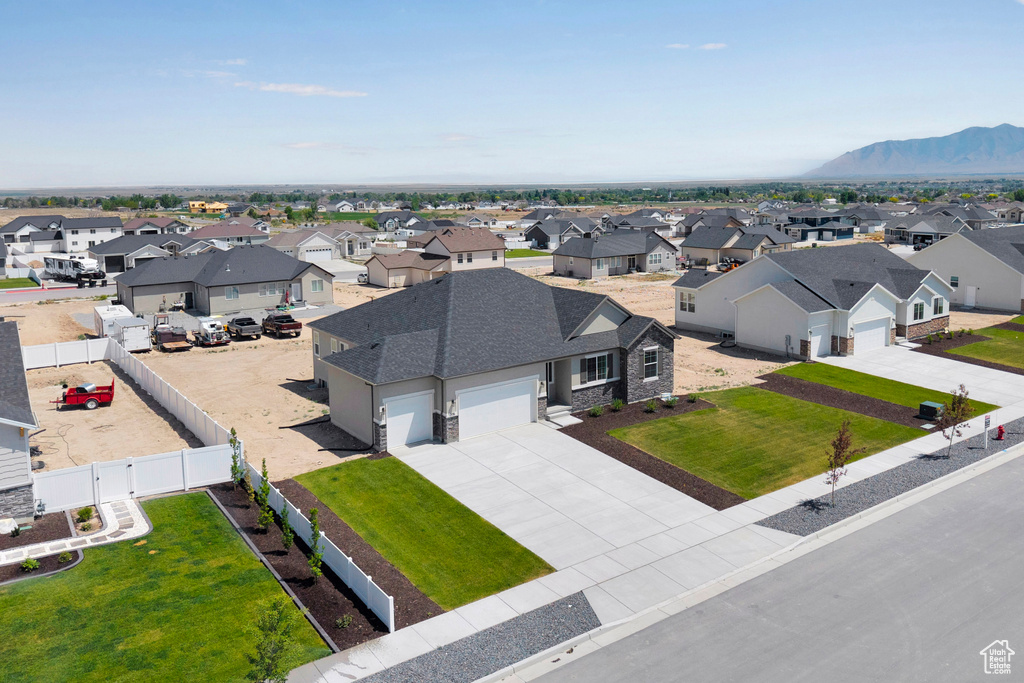 Aerial perspective of suburban area featuring a mountainous background