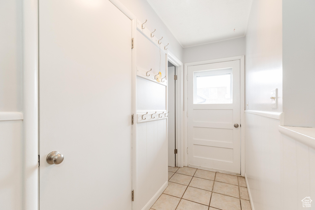 Entryway with light tile patterned floors