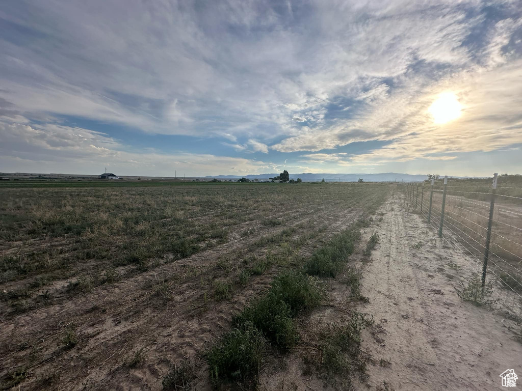 Exterior space featuring a rural view and fence