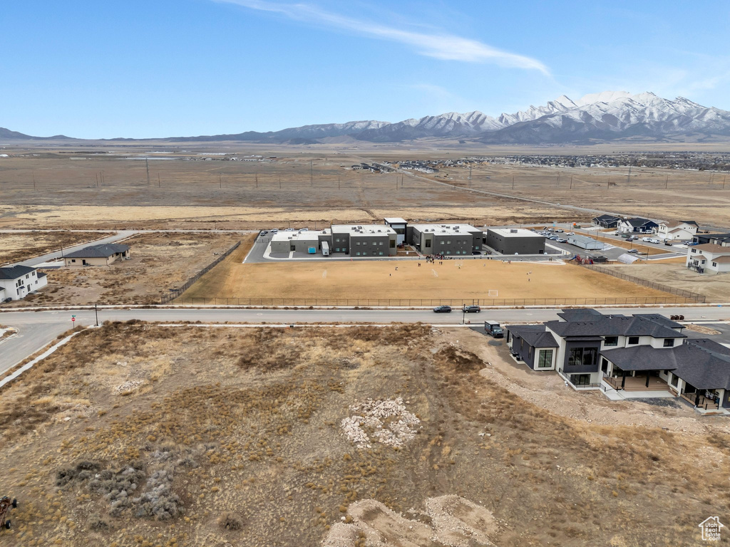 Birds eye view of property with a mountain view and a rural view