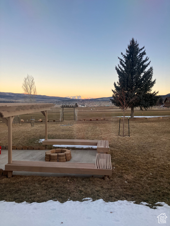 View of yard with an outdoor fire pit