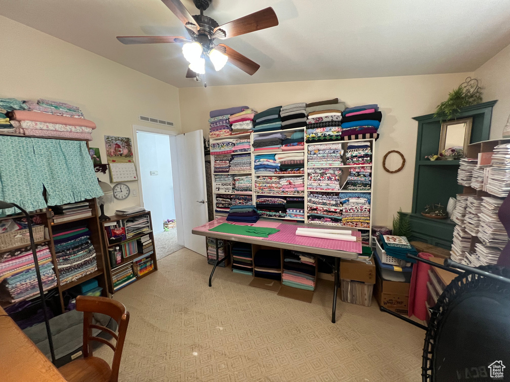 Office with light carpet, ceiling fan, and visible vents