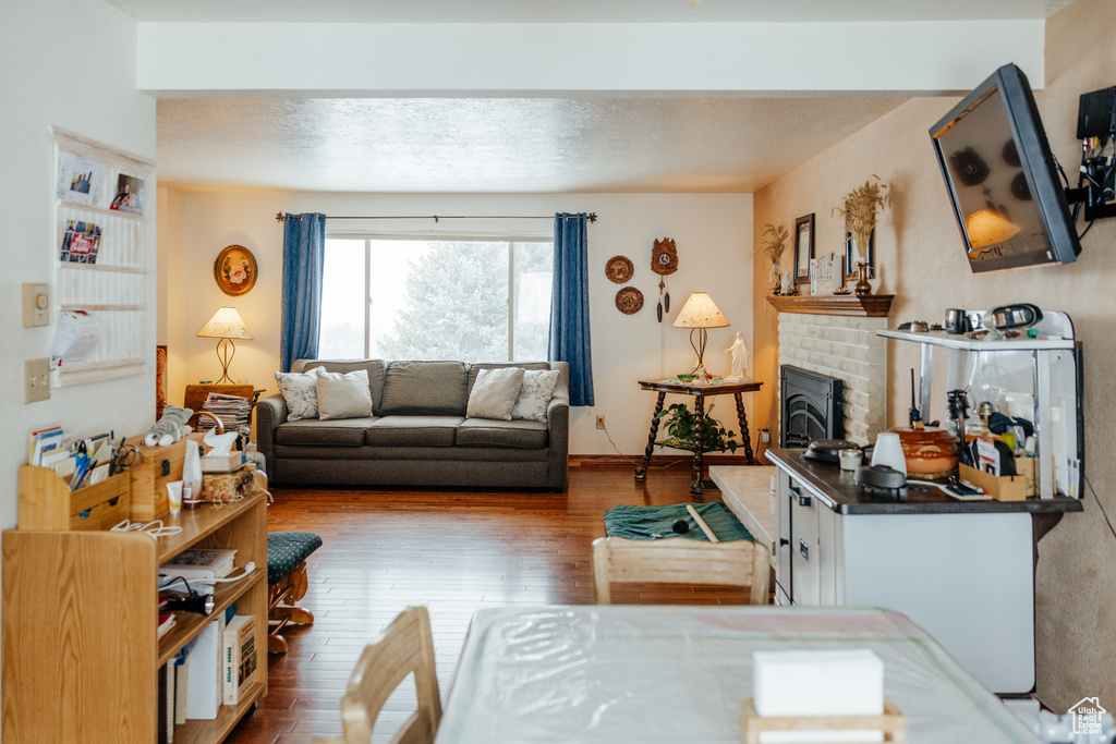 Living area featuring a fireplace and hardwood / wood-style flooring