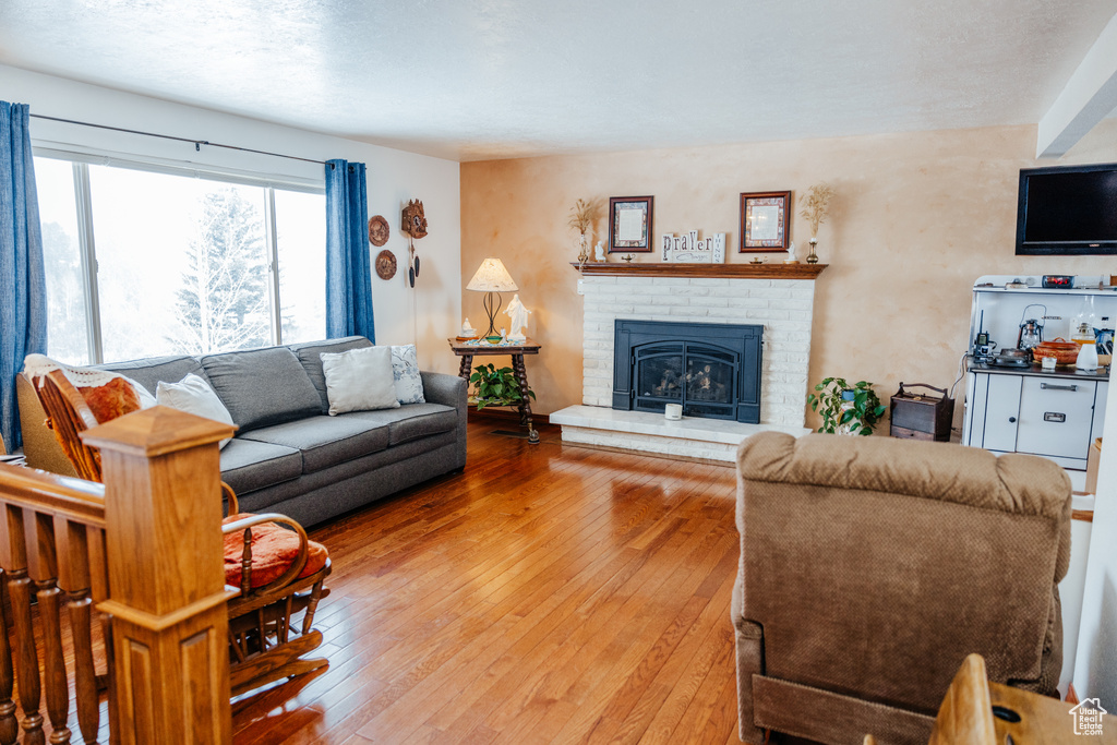 Living area featuring hardwood / wood-style floors and a fireplace