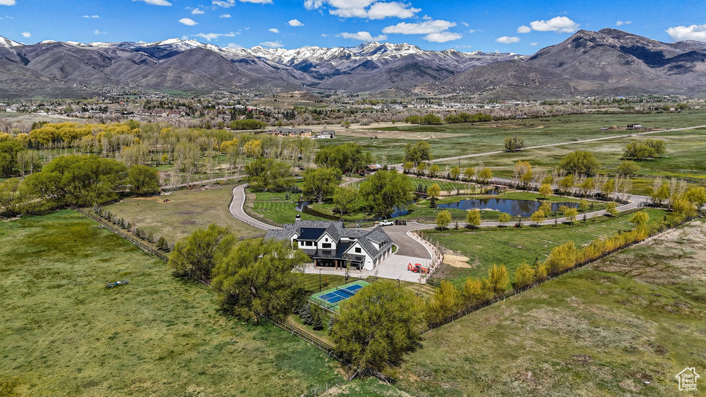 Aerial view featuring a water and mountain view