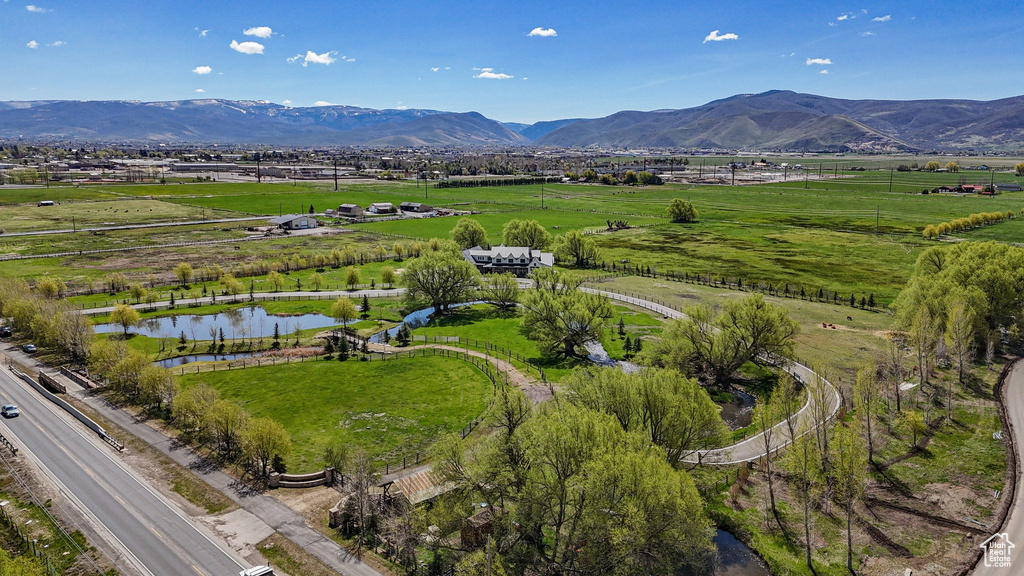 Drone / aerial view with a rural view and a water and mountain view