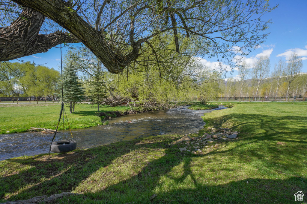 Surrounding community with a yard and fence