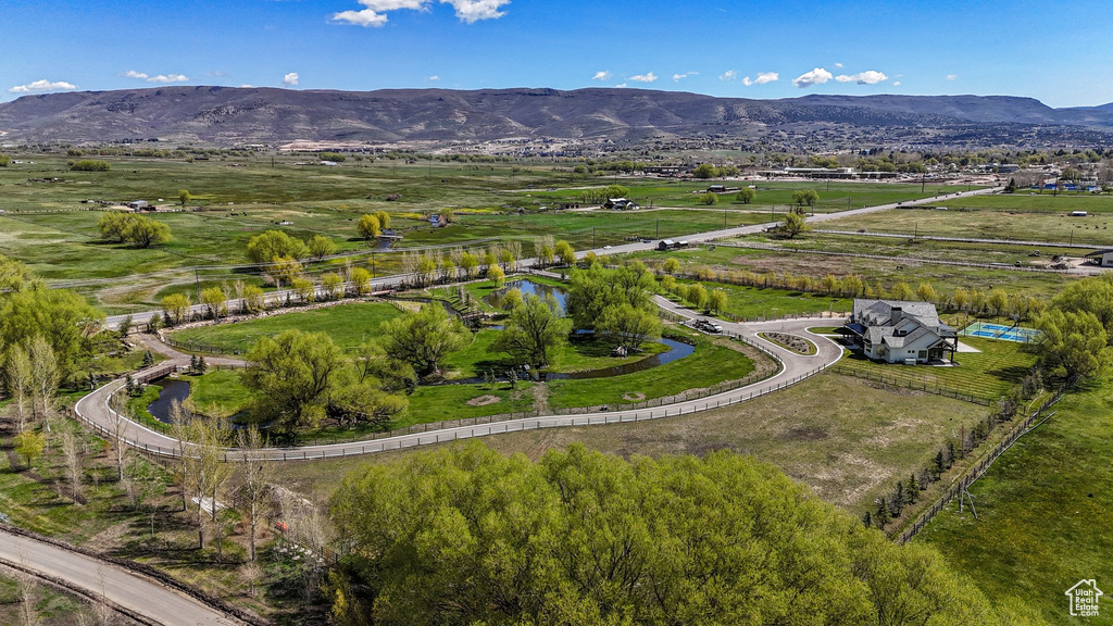 Birds eye view of property with a mountain view and a rural view