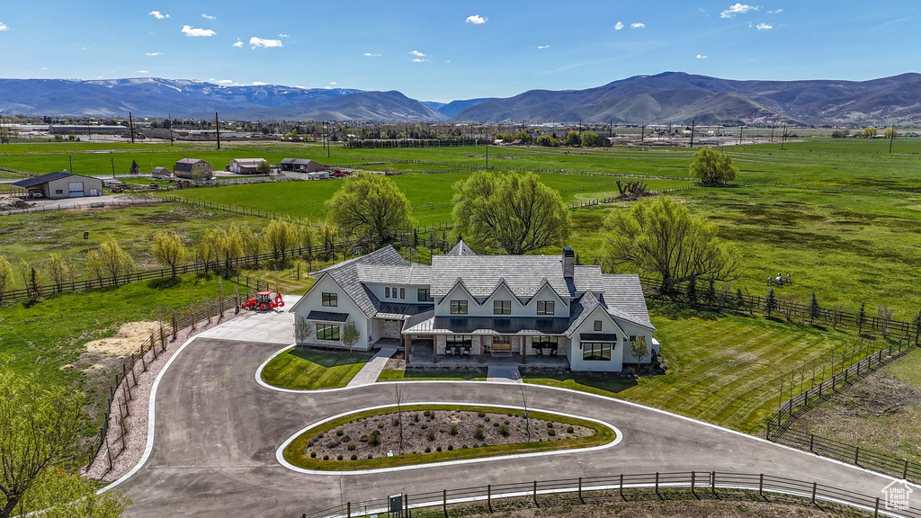 Aerial view featuring a rural view and a mountain view