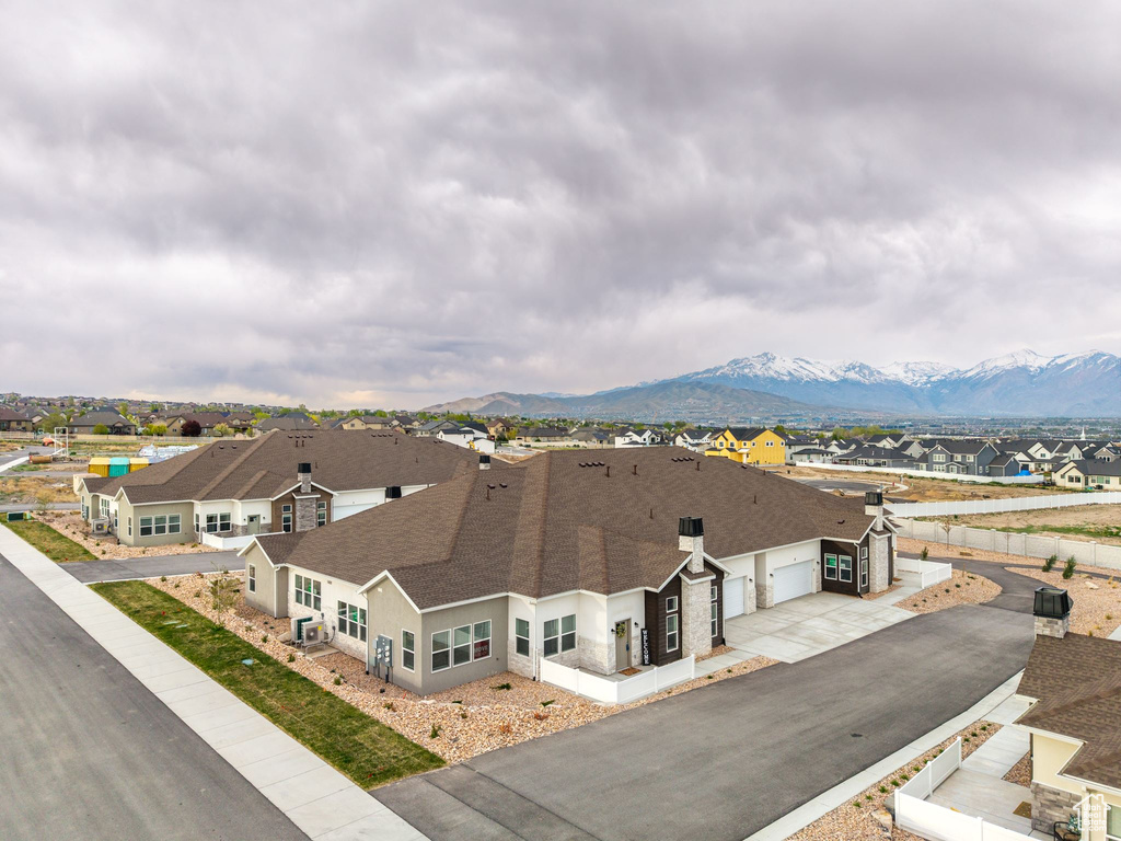 Aerial view of residential area featuring a mountain backdrop