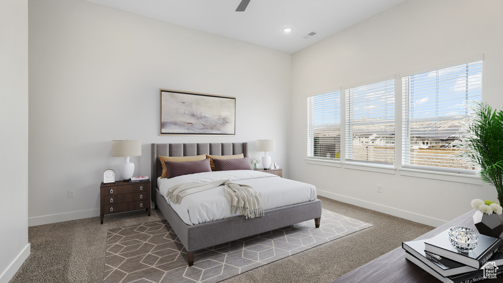 Bedroom featuring ceiling fan and carpet