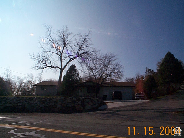 View of front of home featuring uncovered parking