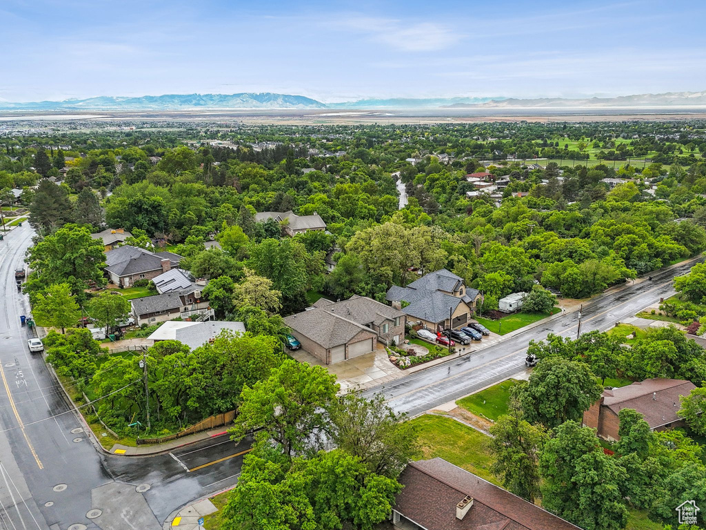 Aerial view of residential area featuring a mountainous background
