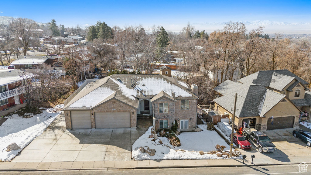 Snowy aerial view with a residential view