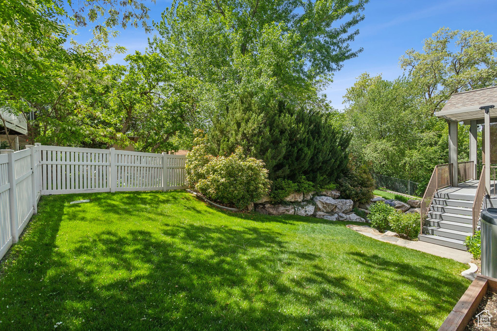 View of yard featuring stairs