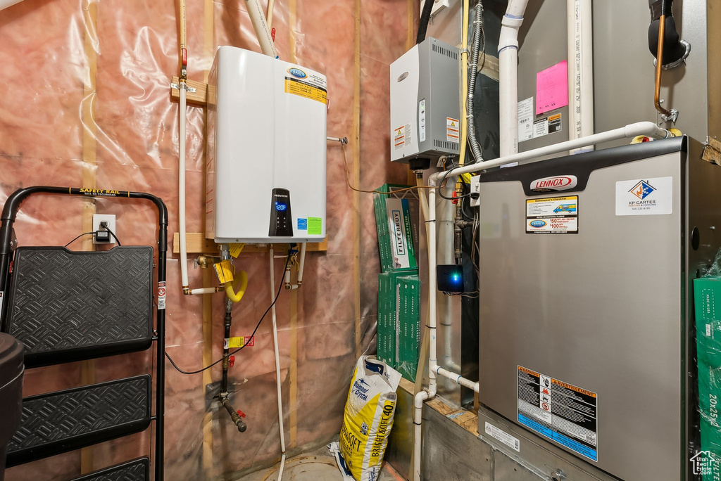 Utility room with water heater and heating unit