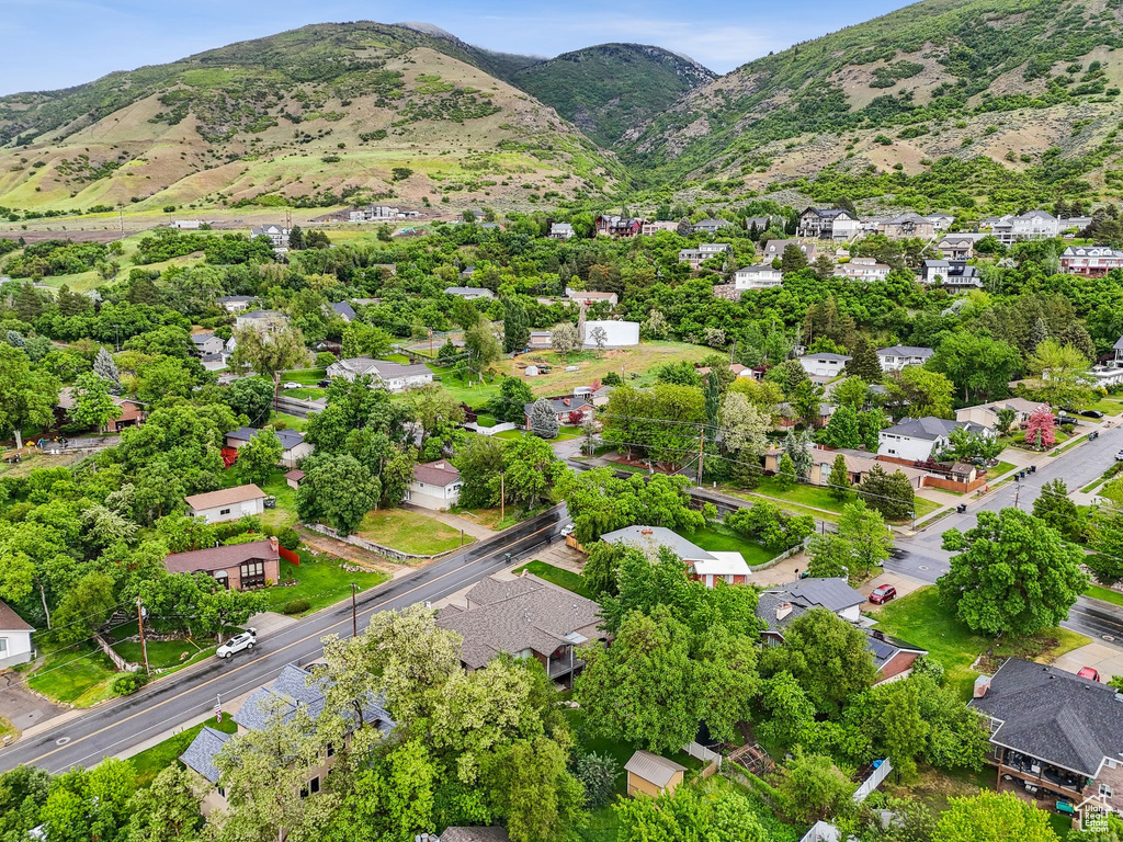 Aerial view of residential area featuring a mountainous background