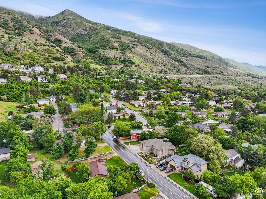 Aerial perspective of suburban area featuring a mountainous background