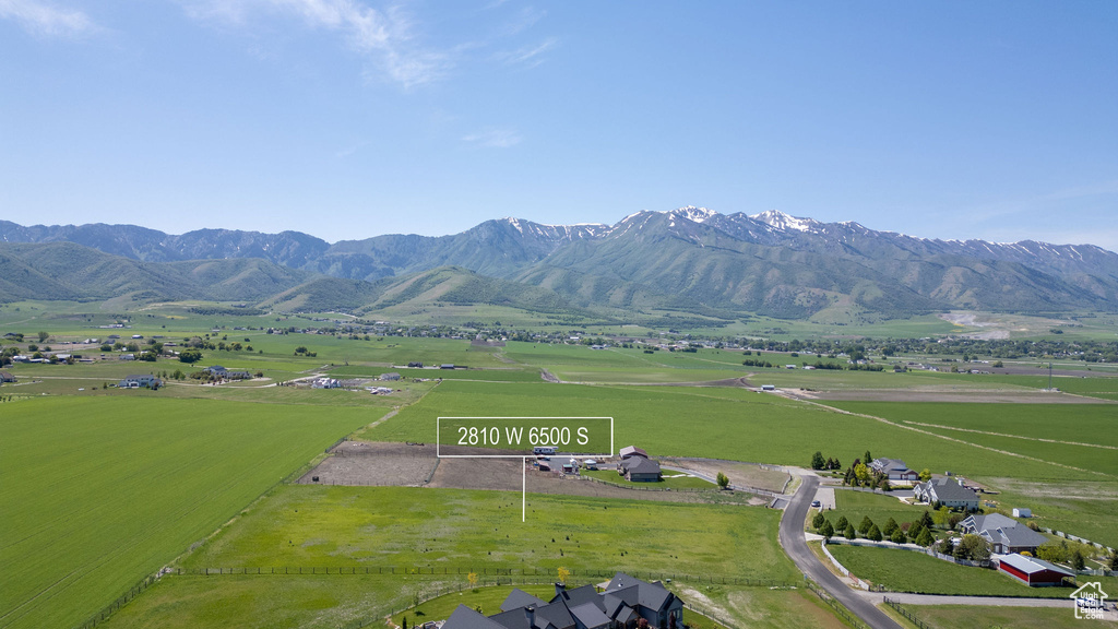 View of mountain background featuring rural landscape