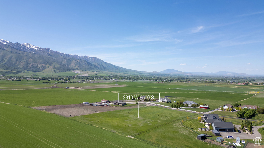 View of mountain background featuring rural landscape