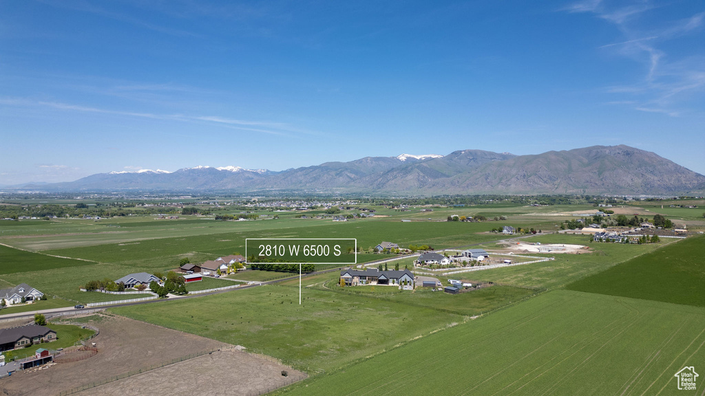 View of mountain backdrop featuring rural landscape
