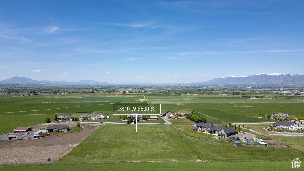 Aerial view of sparsely populated area featuring a mountainous background