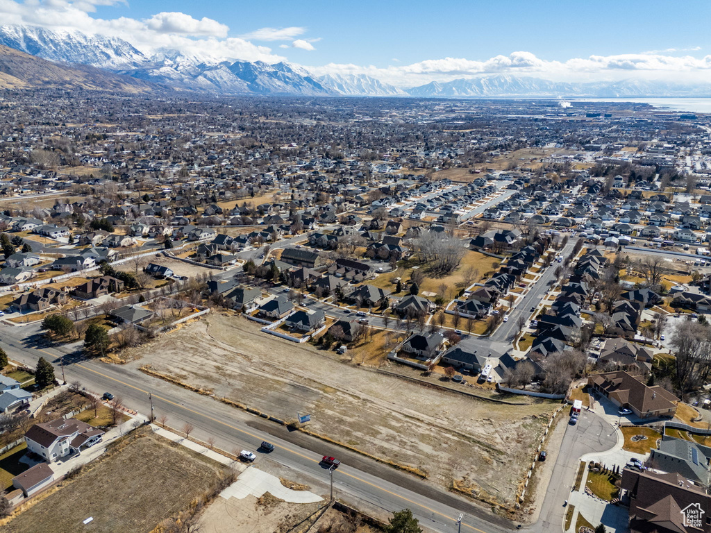 Drone / aerial view with a residential view and a mountain view