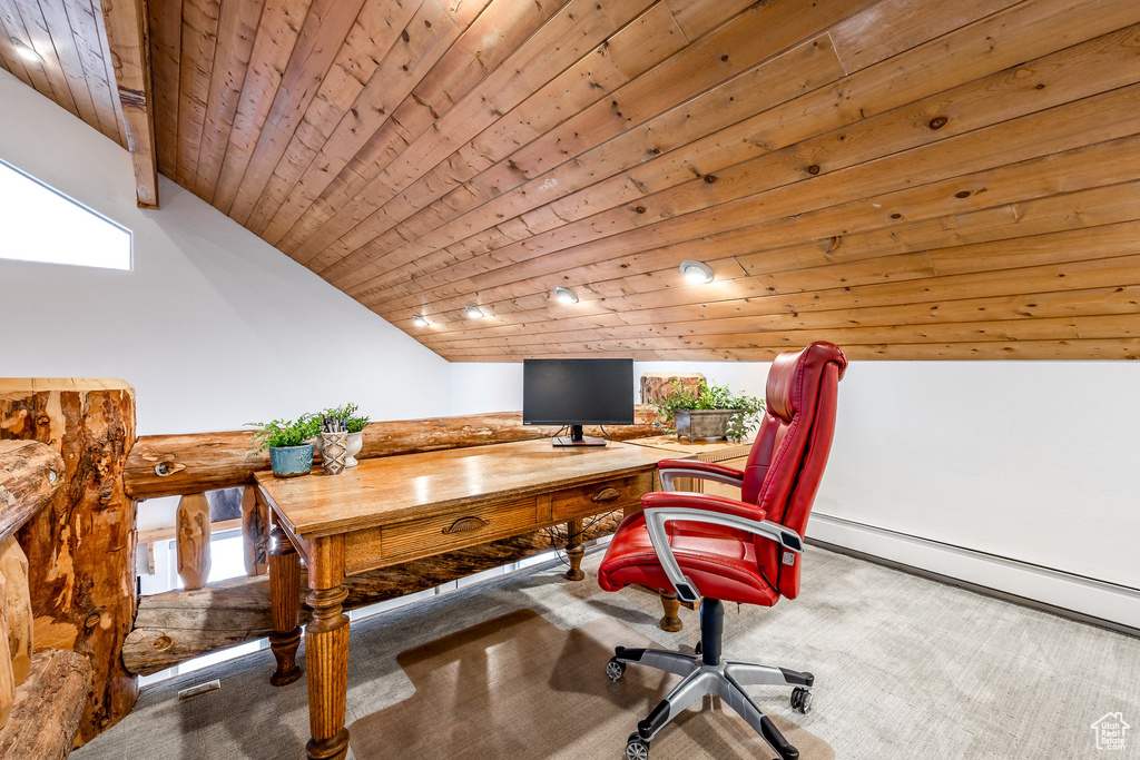 Office area with carpet, wooden ceiling, a healthy amount of sunlight, and lofted ceiling