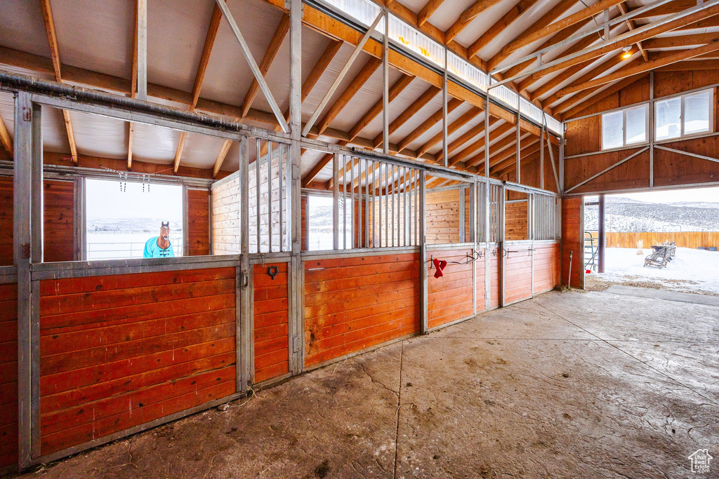 View of horse barn with a mountain view